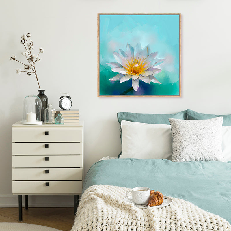 Canvas art print featuring a white lotus flower contrasting against vibrant aquamarine water in a white and blue bedroom.