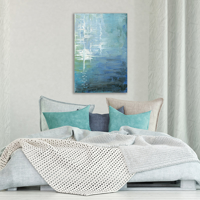 Abstract impressionist art print of calm blue-green sea water illuminated by moonlight, in a contemporary bedroom.